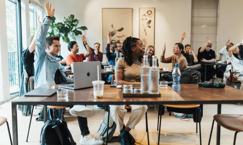 "Group of People Raising Hands"; Photo by: Matheus Bertelli; Src: https://www.pexels.com/photo/group-of-people-raising-hands-18999256/; Lic: Pexels License (free to use).